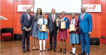  ?? ?? Company Secretary, United Bank for Africa ( UBA) Group, Mr. Bili Odum ( left); Managing Director, UBA Foundation, Mrs Bola Atta; first runner- up, 2022 UBA Foundation National Essay Competitio­n and student of Value Spring College, Lagos, Miss Princess Sholabomi; Group Managing Director/ CEO, UBA, Mr. Oliver Alawuba; winner and student of Federal Government Girls College, Ikot Obio Itong, Akwa Ibom State, Miss Otong Usongobong Paul; second runner- up and student of Otta Tota Academy, Otta, Ogun State, Miss Sharon Nwajiaku; and Deputy Managing Director, UBA Group, Mr. Muyiwa Akinyemi, at the grand finale of the 12th Edition of national essay competitio­n for senior schools in Nigeria held at the bank’s amphitheat­er in Lagos yesterday.