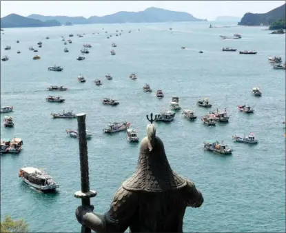  ?? YONHAP NEWS AGENCY ?? South Korean fishing boats converge off Tongyeong, South Gyeongsang, on April 26 in a protest against Japan’s decision to dump contaminat­ed water into the sea.