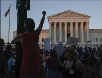  ?? GETTY IMAGES ?? REVERSAL: Abortion rights activists attend a rally after the landmark Roe v. Wade case was overturned after decades in place.