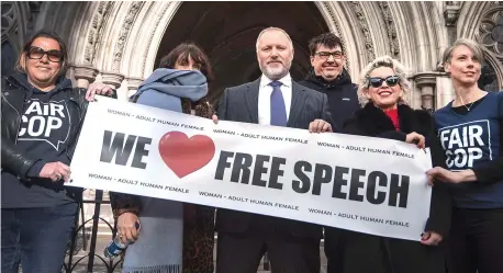  ?? Picture: PA ?? Harry Miller with supporters yesterday outside the High Court after the judge backed his right to make his ‘lawful’ tweets