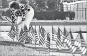  ?? Bruce Lipsky Associated Press ?? AMERICAN f lags are placed on a church lawn in Jacksonvil­le, Fla., on Friday for the Fourth of July.