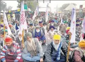  ?? ANI ?? Farmers during the ongoing protest against the new agricultur­e laws at Delhi’s Singhu border on Sunday.