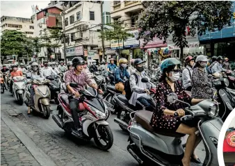  ??  ?? LEFT: scooters and motorcycle­s crowd Hanoi’s streets; and a branch of Highlands Coffee on Le Duan Street