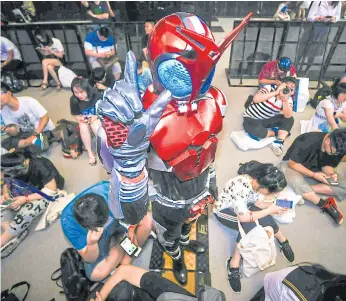 ??  ?? BUGGED OUT: A costumed participan­t attends Bilibili Macro Link 2017, an annual convention of animation, comic and game (ACG) enthusiast­s, in Shanghai.