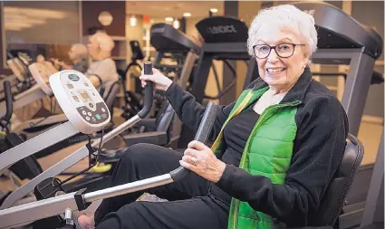  ?? ARAM BOGHOSIAN/KAISER HEALTH NEWS/TNS ?? Resident Bea Lipsky works out in the gym on her birthday at Orchard Cove in Canton, Mass.