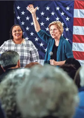  ??  ?? Democratic 2020 presidenti­al hopeful Sen. Elizabeth Warren waves to supporters as Shelby County Commission­er Tami Sawyer (left) looks on during a campaign stop Sunday at Douglass High. MARK WEBER/THE COMMERCIAL APPEAL