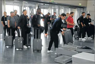  ?? Picture: REUTERS ?? END OF THE ROAD: The Germany soccer team queue while passing through a security checkpoint before their departure at Vnukovo airport in Moscow, Russia yesterday