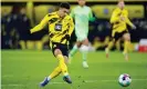  ??  ?? Jadon Sancho scores Borussia Dortmund’s second goal in a 2-0 win against VfL Wolfsburg. Photograph: Leon Kuegeler/Reuters