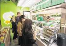  ?? SUBWAY ?? Subway’s redesign, as seen here at a store in Knoxville, Tenn., includes a brighter atmosphere, displays of vegetables and ordering tablets, and is the first major revamp since the early 2000s.