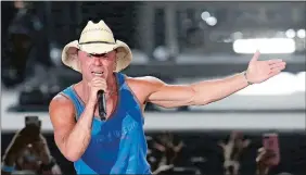  ?? RICK SCUTER, INVISION/AP PHOTO ?? Kenny Chesney performs during the Trip Around the Sun Tour in Phoenix in June.