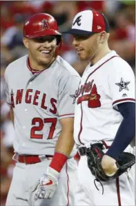  ?? PATRICK SEMANSKY — THE ASSOCIATED PRESS ?? Angels outfielder Mike Trout (27) talks with Braves first baseman Freddie Freeman (5) during the All-star Game on Tuesday in Washington.