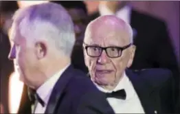  ?? FILE — THE ASSOCIATED PRESS ?? Rupert Murdoch, right, Chairman of Fox News Channel, walks with Australian Prime Minister Malcolm Turnbull, left, to their table for dinner aboard the USS Intrepid in New York. Britain’s government stalled Twenty-First Century Fox’s takeover of the Sky...