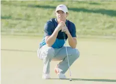  ?? — USA Today Sports ?? Rory McIlroy lines up a putt on the 18th hole during the final round of the BMW Championsh­ip at Conway Farms Golf Club.