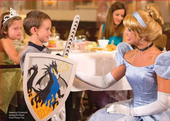  ??  ?? Meeting Cinderella during the Royal Court Royal Tea