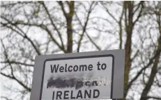  ?? — Reuters file photo ?? A defaced ‘Welcome to Northern Ireland’ sign stands on the border in Middletown, Northern Ireland.