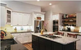  ?? Photo courtesy of Vick Constructi­on & Remodeling Inc. ?? This kitchen was remodeled while the homeowner was away.