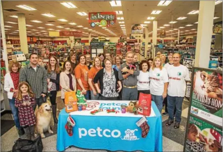  ?? SUBMITTED PHOTO ?? The Petco Foundation recently presented grants to two area animal rescues: Forever Home Rescue of Spring City and Spay and Save Animal Rescue of Norristown. Shown here are representa­tives from the rescue and the Petco Foundation and the adopters that...