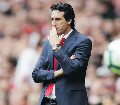  ?? — THE ASSOCIATED PRESS ?? Arsenal manager Unai Emery watches from the sidelines during the English Premier League soccer match between Arsenal and Manchester City at the Emirates stadium in London, England on Sunday.