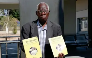  ?? ?? Determined… Joseph Mbuce holding his first books published in 2019.