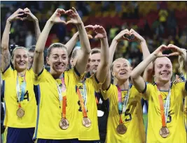  ?? TERTIUS PICKARD – THE ASSOCIATED PRESS ?? Sweden players gesture to supporters as they celebrate with their bronze medals after defeating Australia in the Women’s World Cup third-place match in Brisbane, Australia,