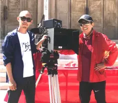  ??  ?? Zhang (right) during the blessing ceremony for the filming of ‘One Second’ in Dunhuang.