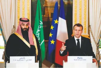 ?? YOAN VALAT/POOL/REUTERS ?? TOP: French police stand by as a convoy reportedly transporti­ng Saudi Crown Prince Mohammed bin Salman leaves the Château Louis XIV outside Paris on Thursday. ABOVE: French President Emmanuel Macron, right, and Mohammed at a news conference at the Élysée Palace in Paris in April 2018.