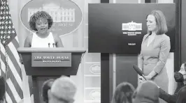  ?? EVAN VUCCI AP ?? White House press secretary Jen Psaki, right, listens as incoming press secretary Karine Jean-Pierre speaks during a press briefing at the White House on Thursday.