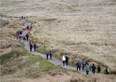  ?? WALES NEWS SERVICE ?? Walkers hike up Pen Y Fan in the Brecon Beacons