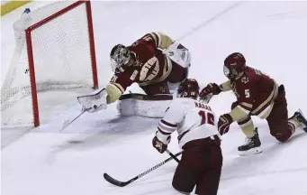  ?? ASSOCIATED PRESS ?? NETTING A BIG ONE: Cale Makar fires a shot past Boston College goalie Joseph Woll to spark UMass to a 4-3 victory last night in Amherst.