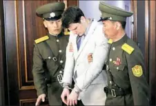 ?? Jon Chol Jin/Associated Press ?? In this March 2016 file photo, Otto Warmbier, center, is escorted at the Supreme Court in Pyongyang, North Korea.
