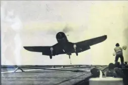  ??  ?? Mr Quilter has a photo of his first landing on USS Charger in early 1945