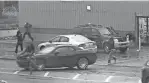  ?? PROVIDED BY U.S. DISTRICT COURT RECORDS ?? FBI pole cameras capture two Detroit gang members opening fire on a vehicle on Dec. 1, 2015. A rival gang member and 13-year-old girl inside the car were killed.
