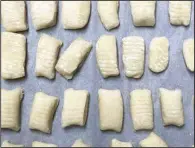  ?? (Arkansas Democrat-Gazette/Kelly Brant) ?? Shaped and flour-dusted gnocchi di farina rest before cooking.