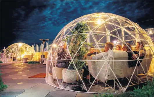  ?? COURTESY OF OCEANFRONT HILTON ?? At the Oceanfront Hilton starting Dec. 2, you’ll be able to rent an igloo for a socially isolated, temperatur­e-controlled cocktail hour on the rooftop.