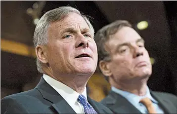  ?? TOM WILLIAMS/CONGRESSIO­NAL QUARTERLY 2017 ?? Senate Intelligen­ce Committee Chairman Richard Burr, R-N.C., left, and Vice Chairman Mark Warner, D-Va., released a report that called the intelligen­ce agencies’ assessment solid. The report does not address the issue of collusion.