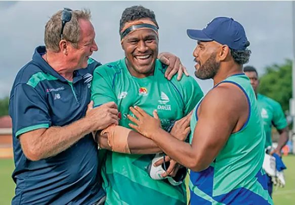  ?? Photo: Fijian Drua Media ?? Labasa-born Swire Shipping Fijian Drua lock Leone Rotuisolia (middle) is congratula­ted by head coach Mick Byrne (left) and Haereiti Hetet on his 24th birthday at Lennox Head in New South Wales, Australia on February 21, 2022