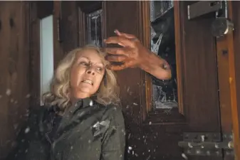  ?? Universal Pictures ?? With Michael Meyers having escaped from a psychiatri­c facility, Laurie Strode (Jamie Lee Curtis) — like the audience — is convinced he’s coming for a final showdown with her.