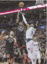  ?? AP PHOTO ?? JUST OUT OF REACH: Raptors guard Delon Wright (55) shoots over Dallas center Nerlens Noel in the first half of last night’s home win in Toronto.