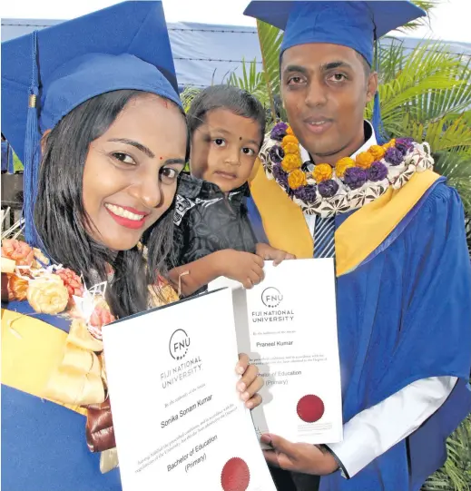  ?? Photo: Vilimoni Vaganalau ?? Sonika Kumar and Praneel Kumar celebrate their Bachelor of Education graduation from the Fiji National University with their son, Arav Kumar at the Vodafone Arena on December 13, 2017.