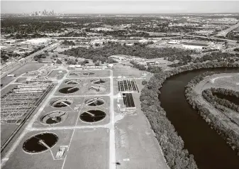  ?? Melissa Phillip / Staff file photo ?? An aerial view of the Sims Bayou South Wastewater Treatment Plant and Sims Bayou in 2017 is shown. Houston officials are leading an effort to test wastewater to track the new coronaviru­s.