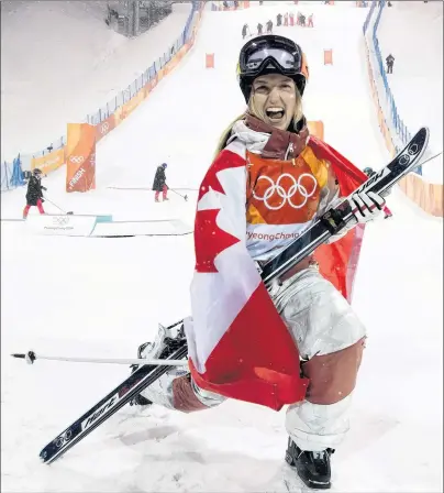  ?? THE CANADIAN PRESS/JONATHAN HAYWARD ?? Justine Dufour-Lapointe, of Montreal, celebrates after competing to her silver medal finish in the freestyle skiing event at the 2018 Winter Olympic Games, in Pyeongchan­g, South Korea, on Sunday.