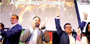  ??  ?? Abascal and regional candidate Francisco Serrano celebrate results after the Andalusian regional elections in Seville. — Reuters photo