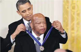  ??  ?? Feb. 15, 2011: U.S. president Barack Obama presents a Presidenti­al Medal of Freedom to the civil rights leader and politician John Lewis during a ceremony at the White House. Obama spoke at Lewis’s funeral in Atlanta on July 30.