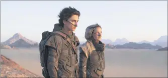  ?? COURTESY OF WARNER BROS. ENTERTAINM­ENT ?? Timothee Chalamet and Rebecca Ferguson in a scene from “Dune.”