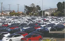  ?? STEPHEN LAM/REUTERS FILES ?? Tesla posted a surprise quarterly profit, as it delivered a record 97,000 cars. U.S. growth is seen as a challenge.