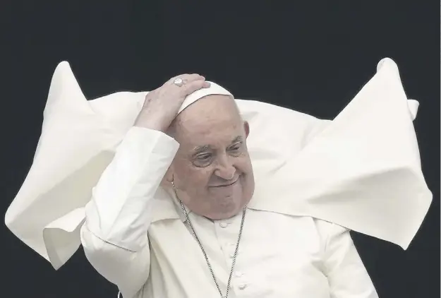  ?? ?? Pope Francis presides over Easter Sunday Mass in a windy, flower-decked St Peter's Square and delivers a heartfelt prayer for peace in his annual round-up of global crises