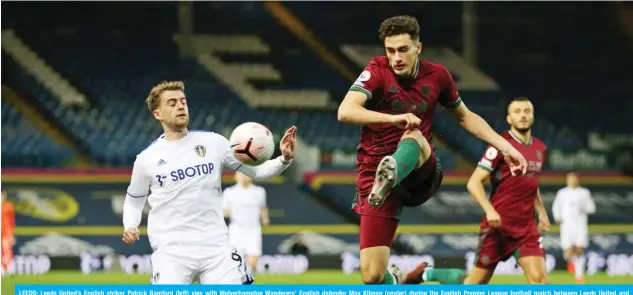  ??  ?? LEEDS: Leeds United’s English striker Patrick Bamford (left) vies with Wolverhamp­ton Wanderers’ English defender Max Kilman (center) during the English Premier League football match between Leeds United and Wolverhamp­ton Wanderers at Elland Road in Leeds, northern England on October 19, 2020. — AFP