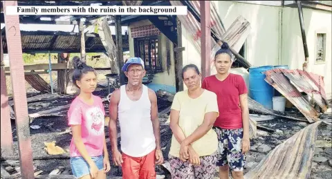  ?? ?? Family members with the ruins in the background