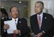  ?? EUGENE HOSHIKO - THE ASSOCIATED PRESS ?? Tokyo Olympic organizing committee President Yoshiro Mori, right, and Toshiro Muto, left, CEO of the Tokyo Organizing Committee of the Olympic and Paralympic Games, speak to the media after attending an IOC Executive Board meeting Saturday, Dec. 1, 2018, in Tokyo.