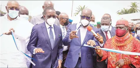  ??  ?? Delta State Deputy Governor, Kingsley Otuaro ( left); Governor Ifeanyi Okowa; his Edo State counterpar­t, Godwin Obaseki and Okobaro of Ughievwen, HRM Matthew Ediri Egbi, Owahwa II, at the commission­ing of Otu- Jeremi- Okwagbe Road in Ughelli South Council Area… yesterday